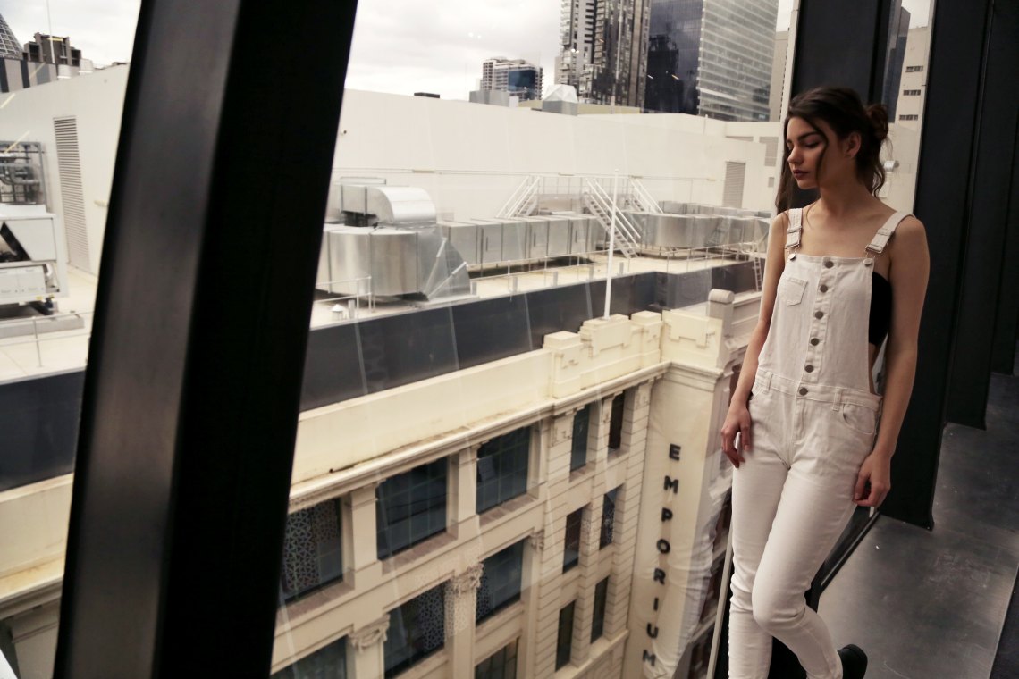  girl in white overalls