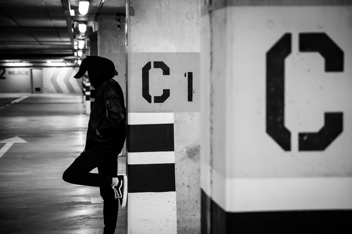 personal black and white waiting while wearing vans