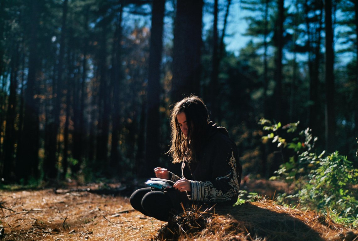 a girl up in the mountains on a sunny day