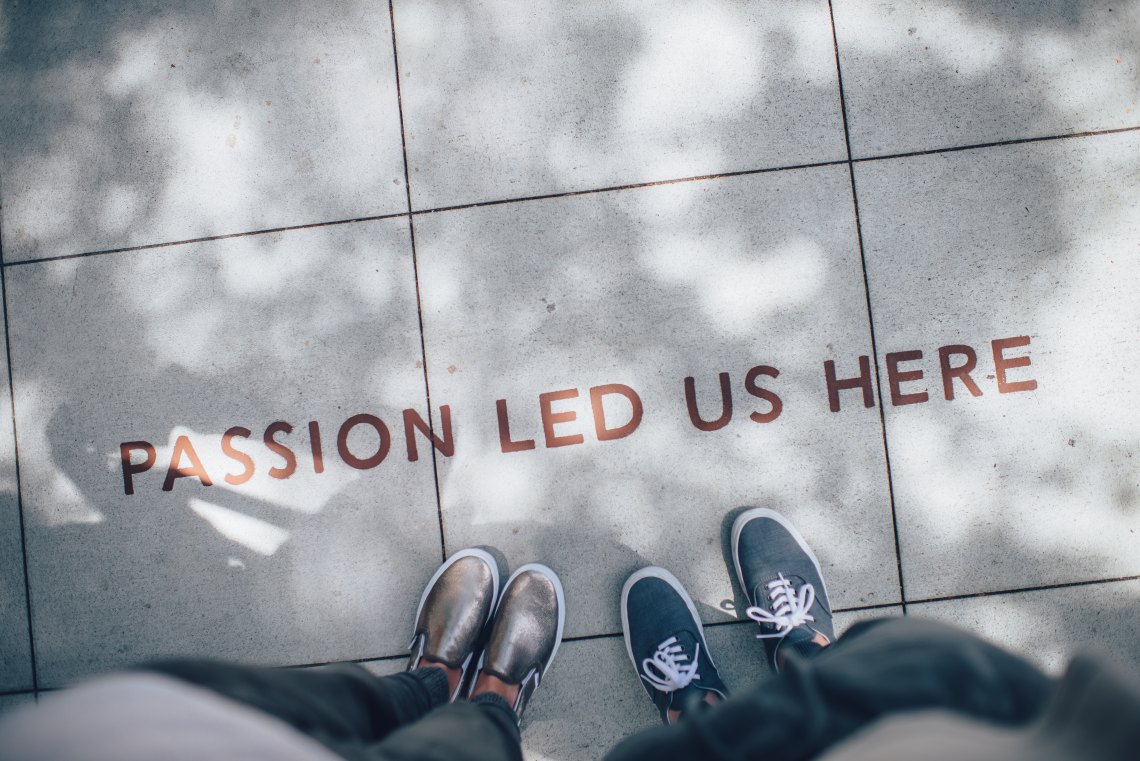 two people in front of "passion" statement 