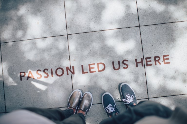 two people in front of "passion" statement