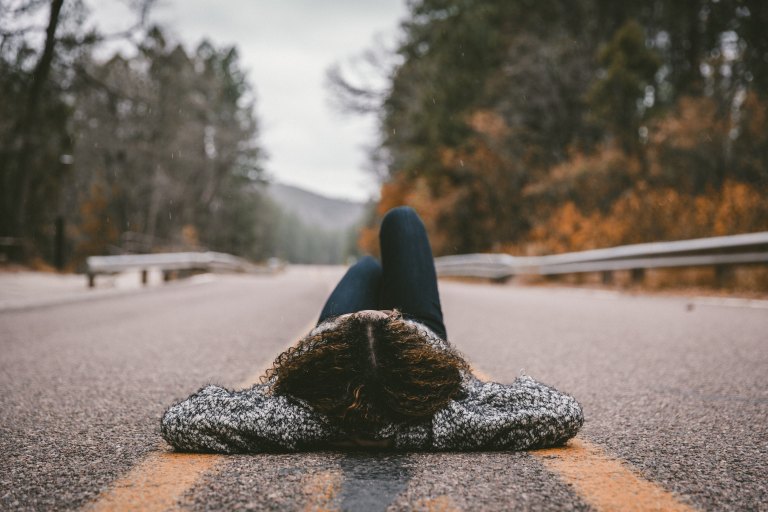 woman laying in street