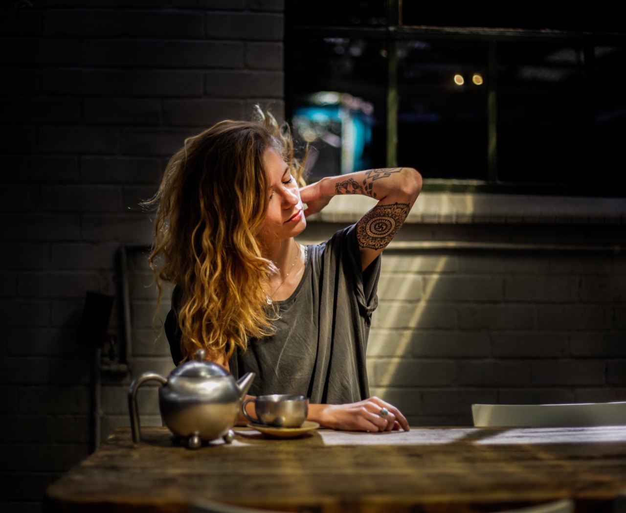 woman sitting drinking coffee