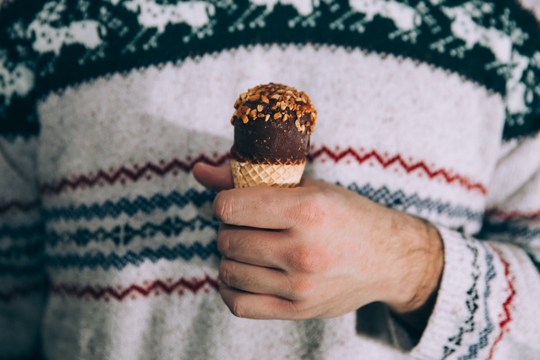 person holding ice cream cone