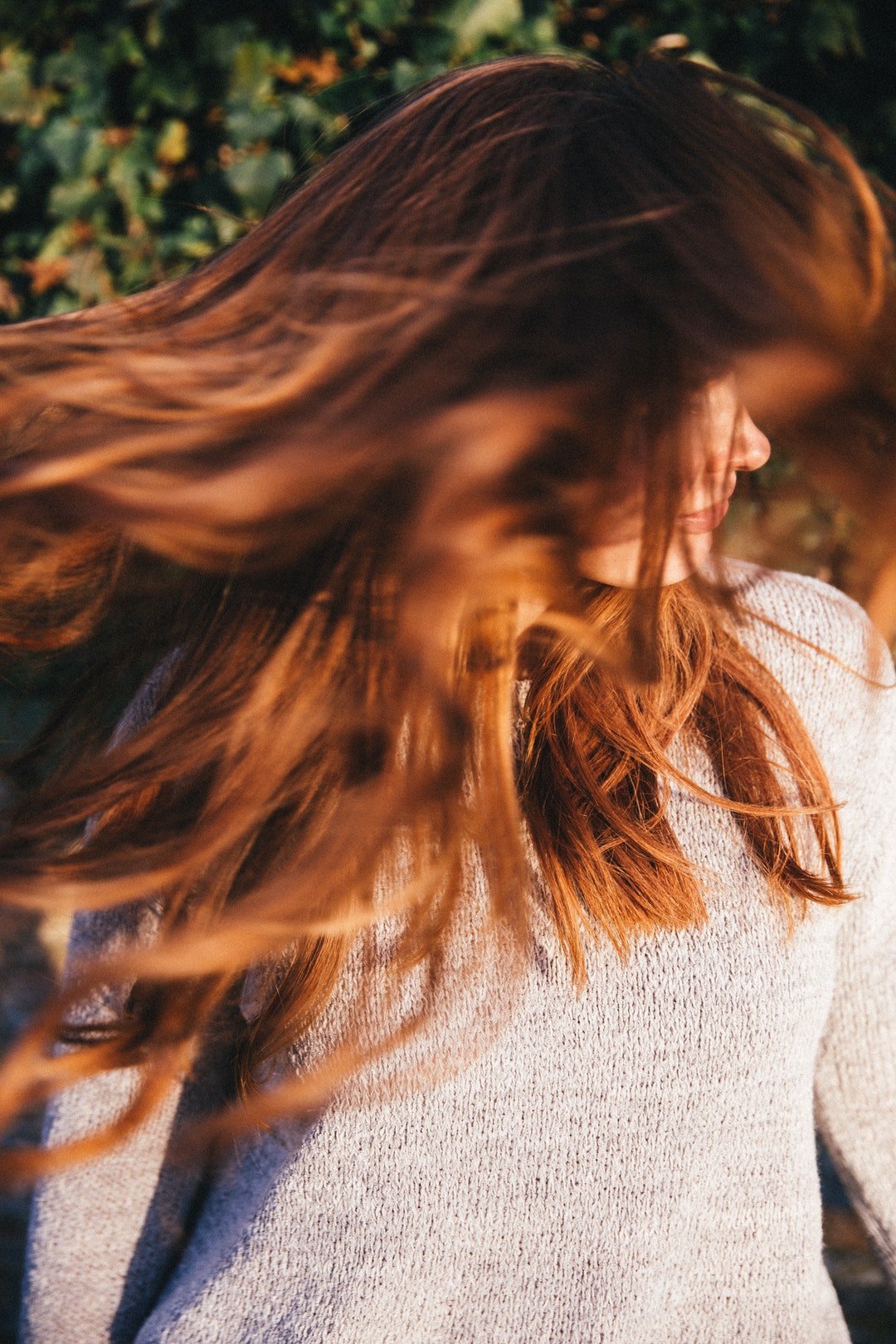 Woman shaking out her hair freely