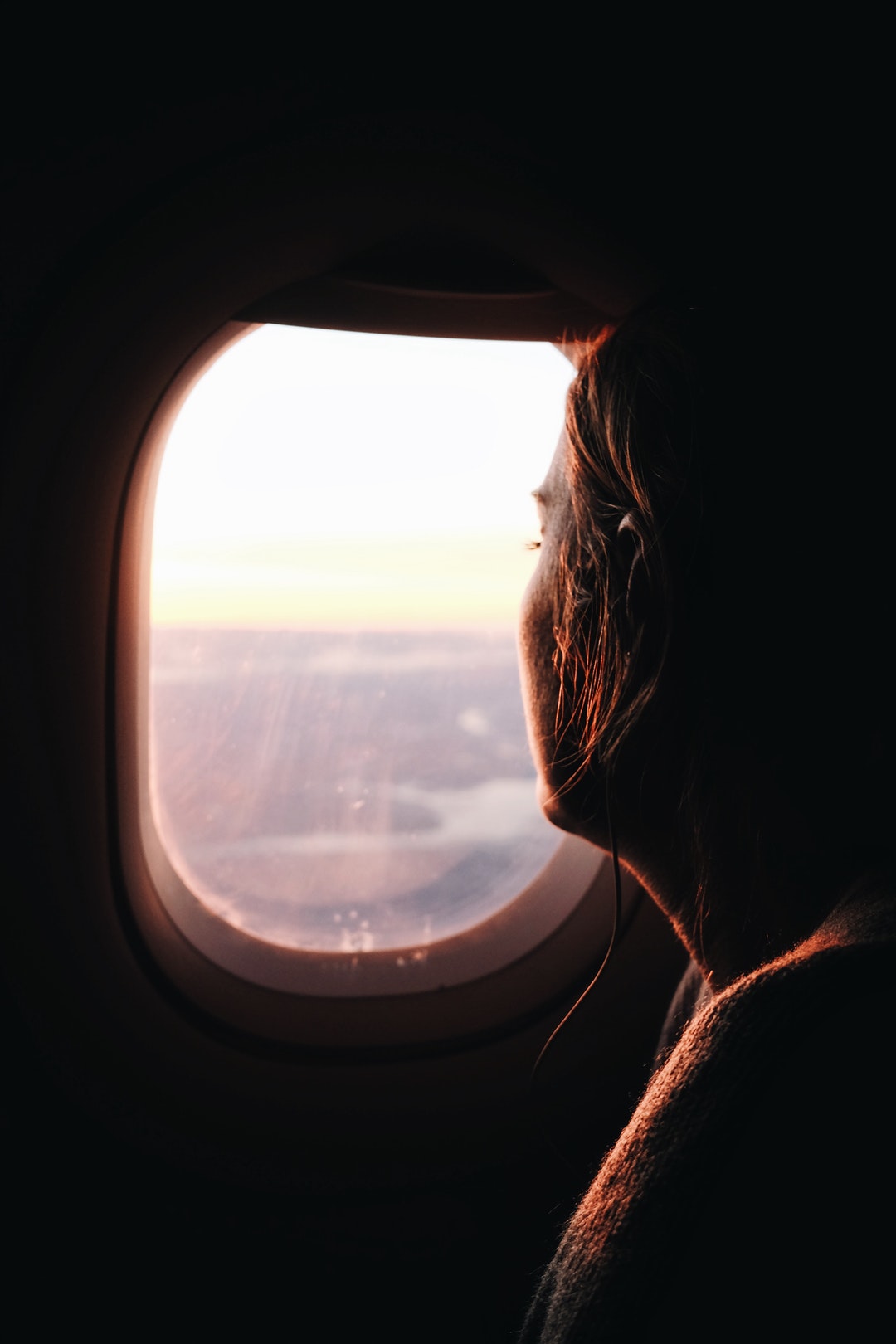 woman looking outside the window