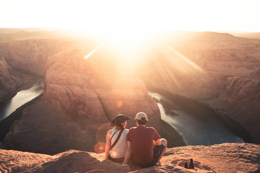 A couple looking at the aerial view of a canyon by a river in Big Bend Campground