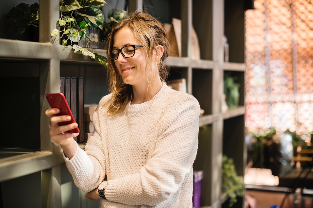 woman holding phone