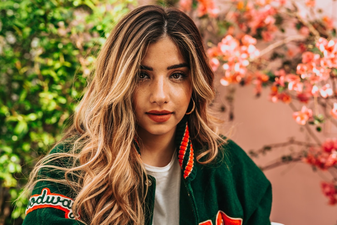 woman in green and red jacket