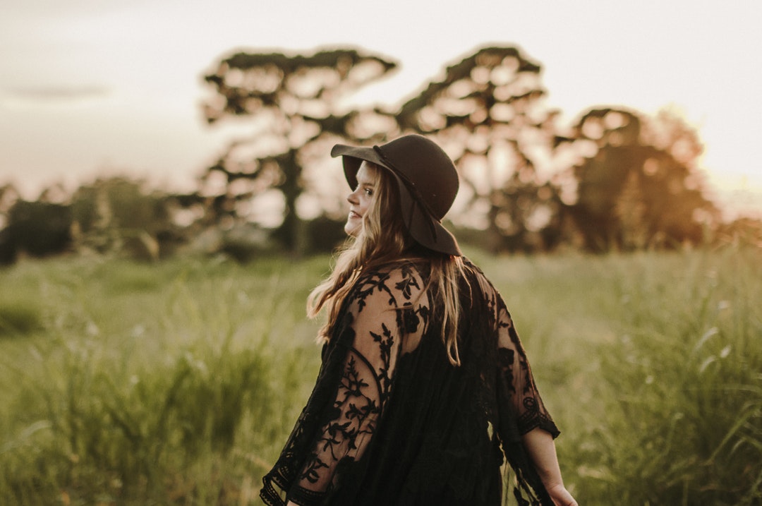 shallow focus of woman on grasses