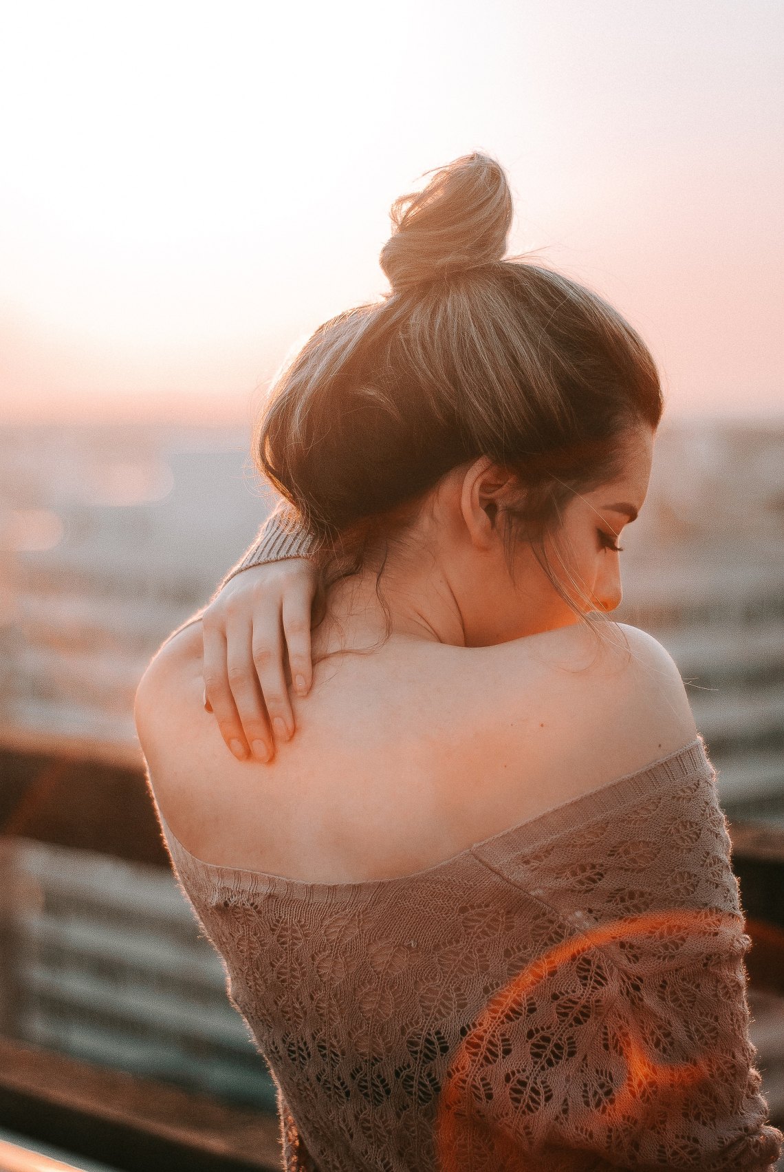 woman standing looking sad