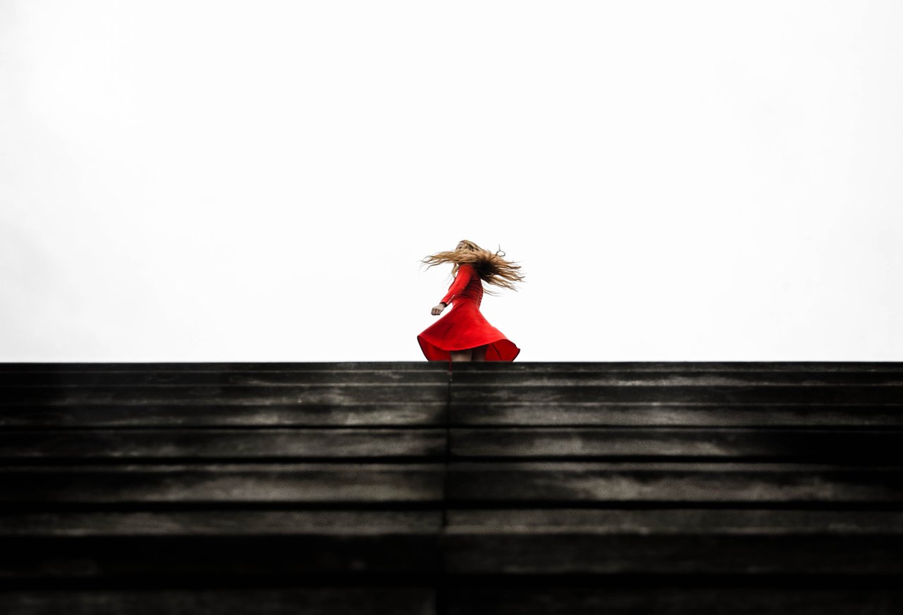 woman dancing in red dress