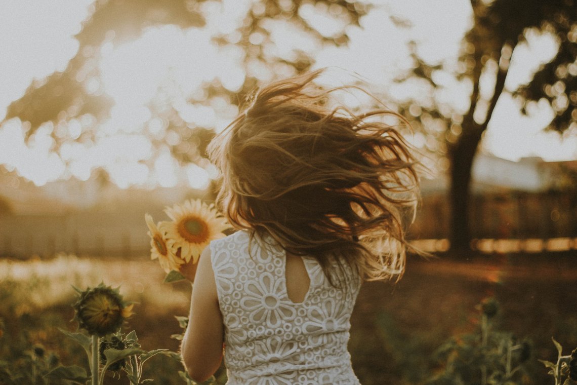 girl in sunflower field