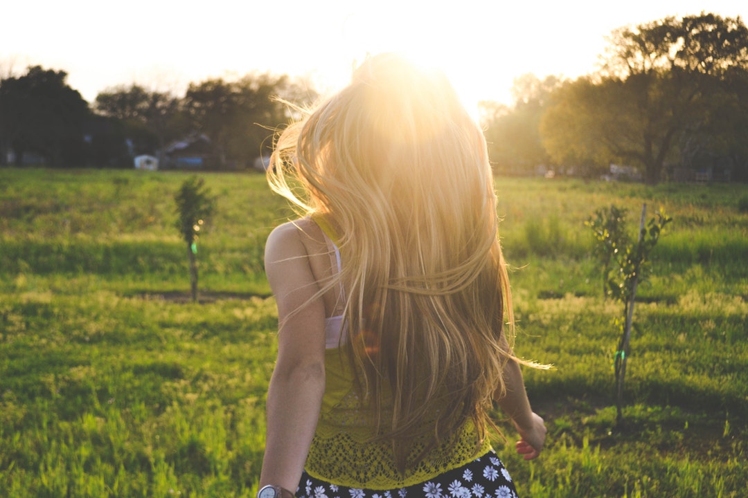 An absolute beautiful sight of a young blonde girl bathed in sunlight