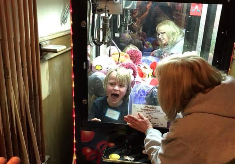 kid stuck in a claw machine