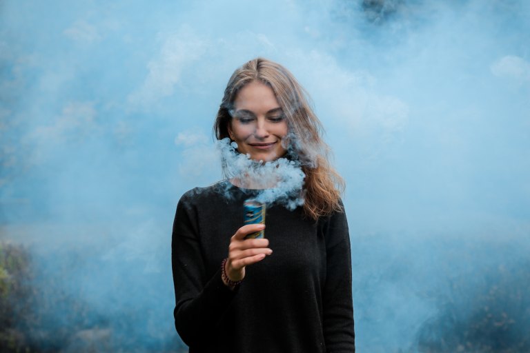 girl with blue smoke