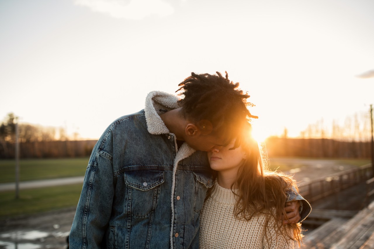 couple about to kiss in the sunlight