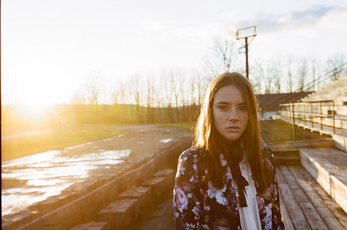 woman standing at sunset