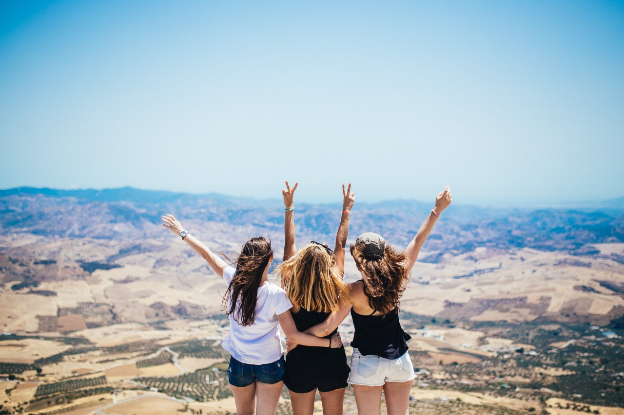 girls with arms up, happy girls celebrating, being a Christian, what it means to be a Christian