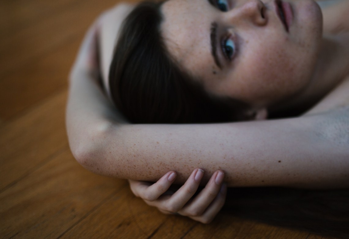 girl laying on floor, cannabis-infused massage, massage, massage therapy, live-changing therapy