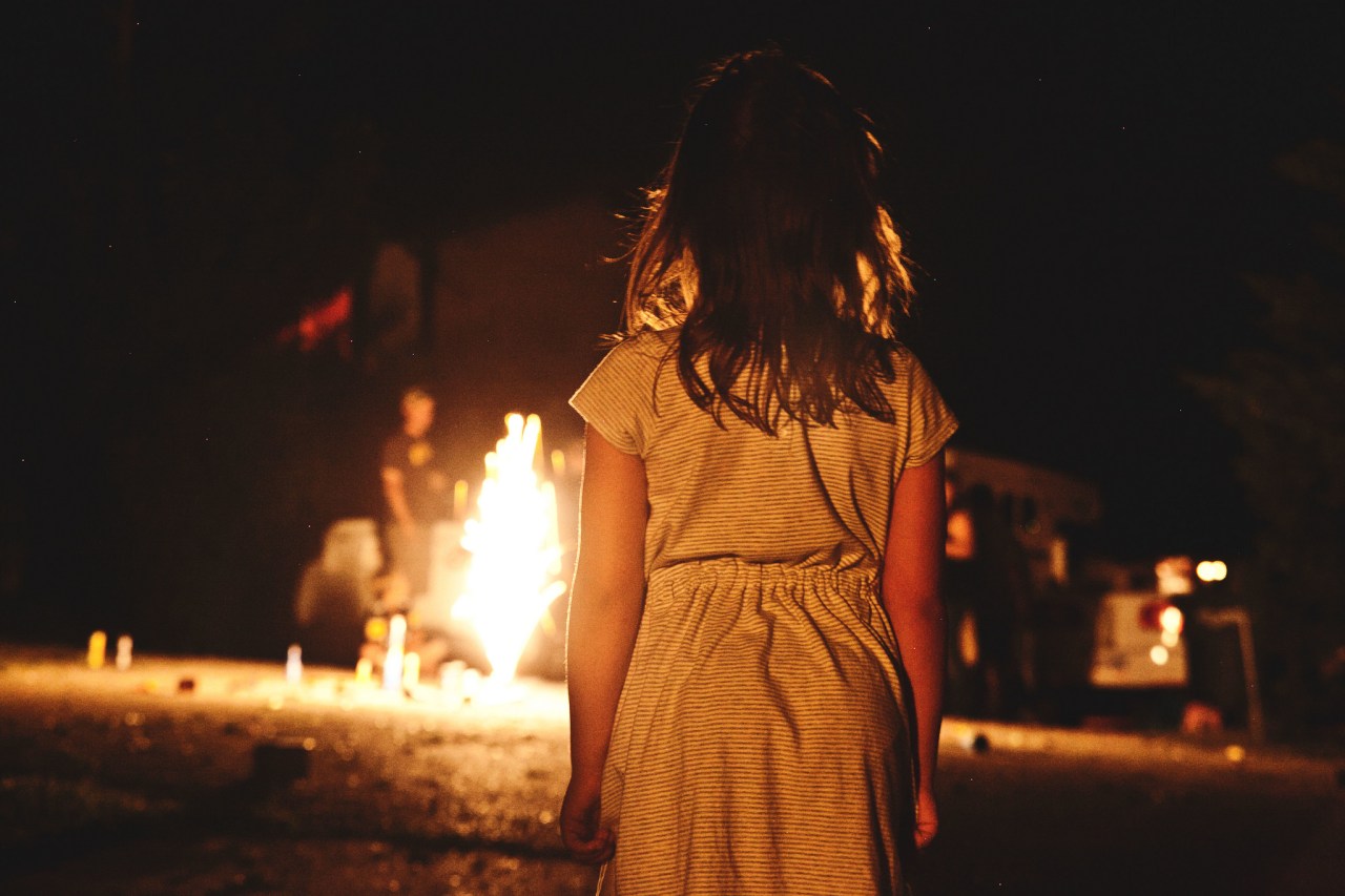 Little girl watches the fire burn, creepy, horror