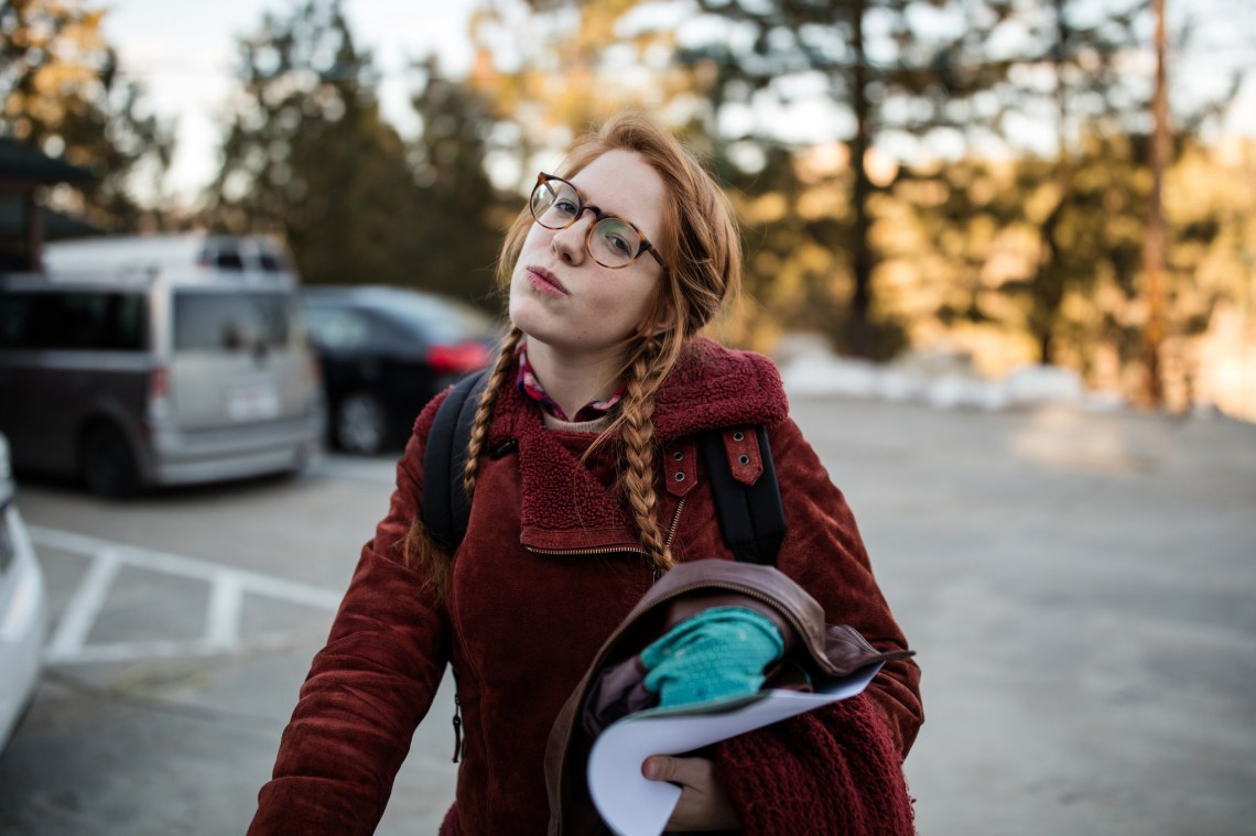 girl with braids and glasses