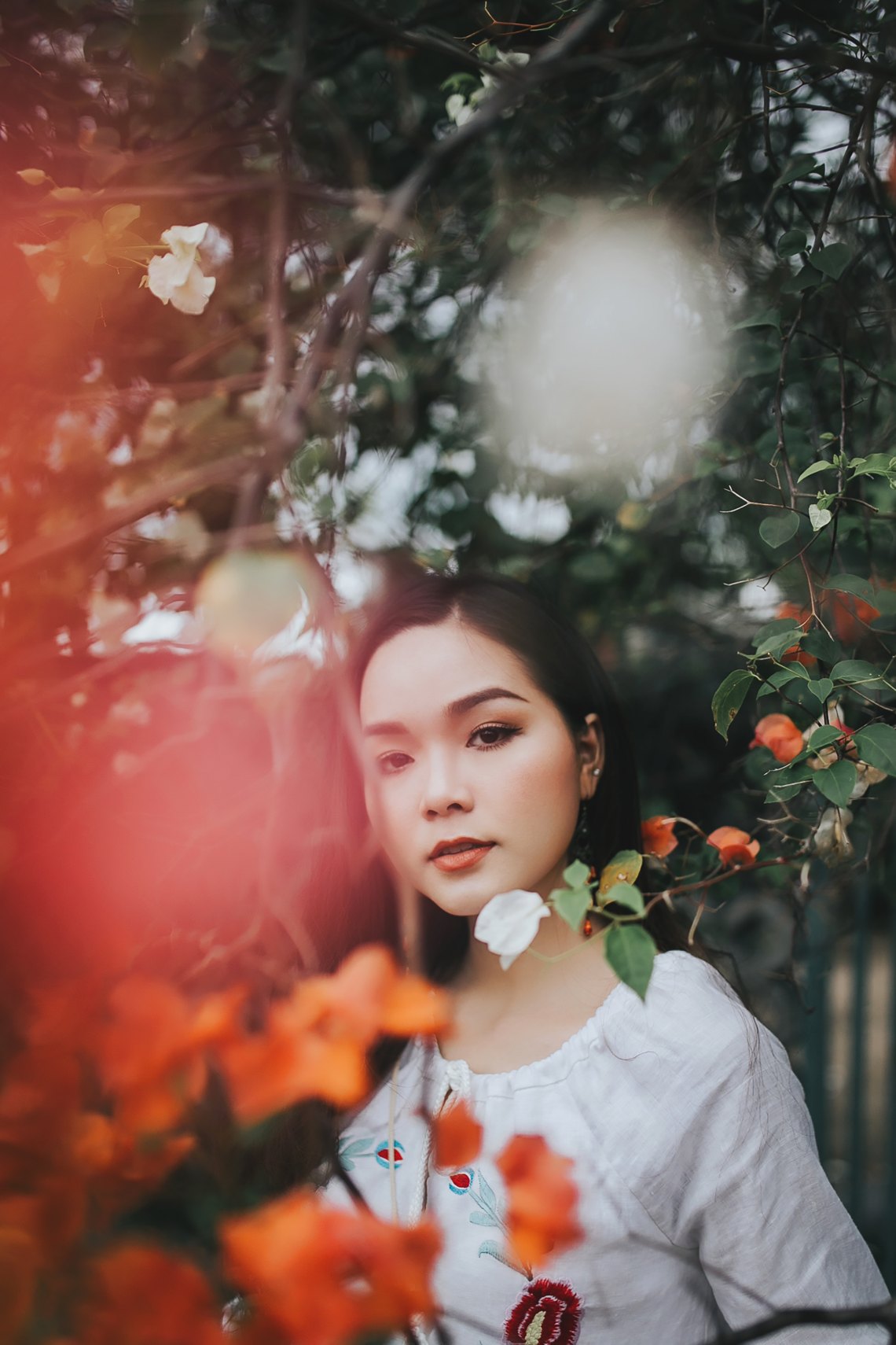 woman standing in flowers