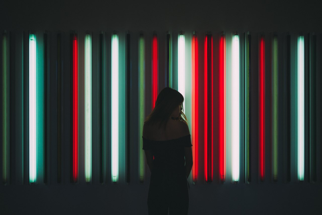 Woman in front of neon lights