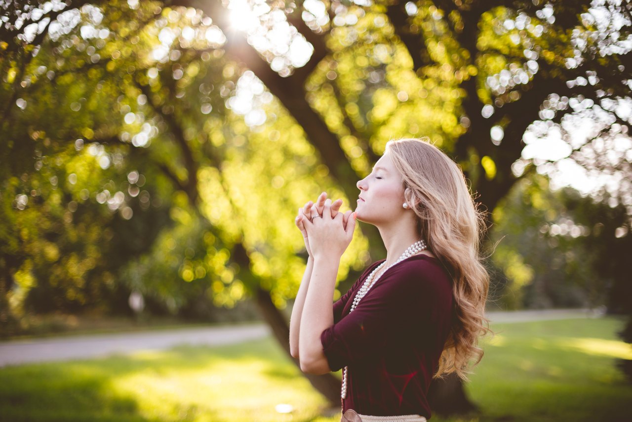 woman standing in sunlight