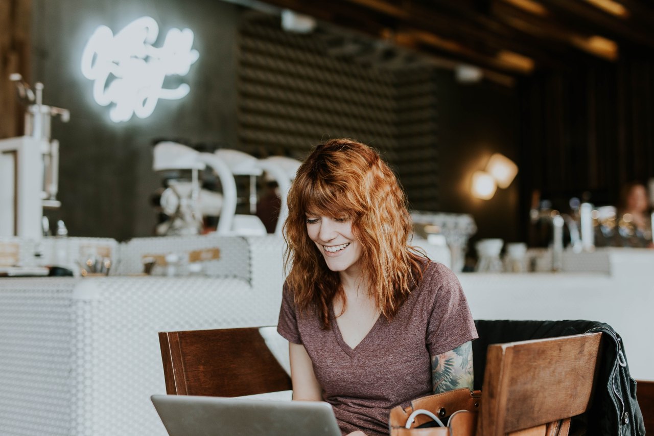 woman writing on laptop