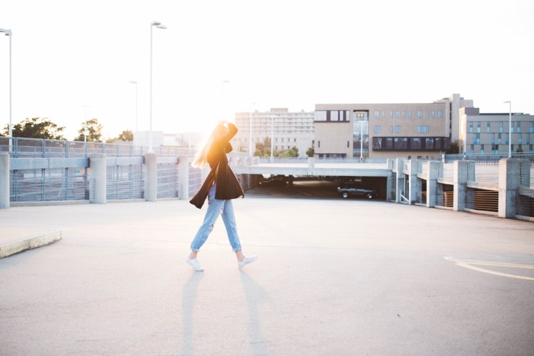 woman walking in parking lot