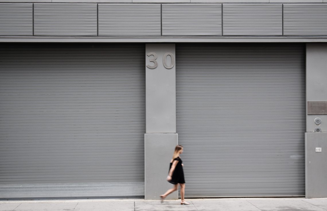 woman walking with 30 above her head