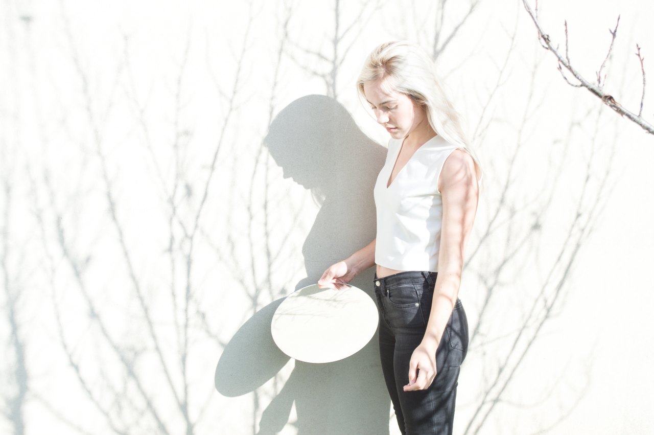 woman standing holding plate