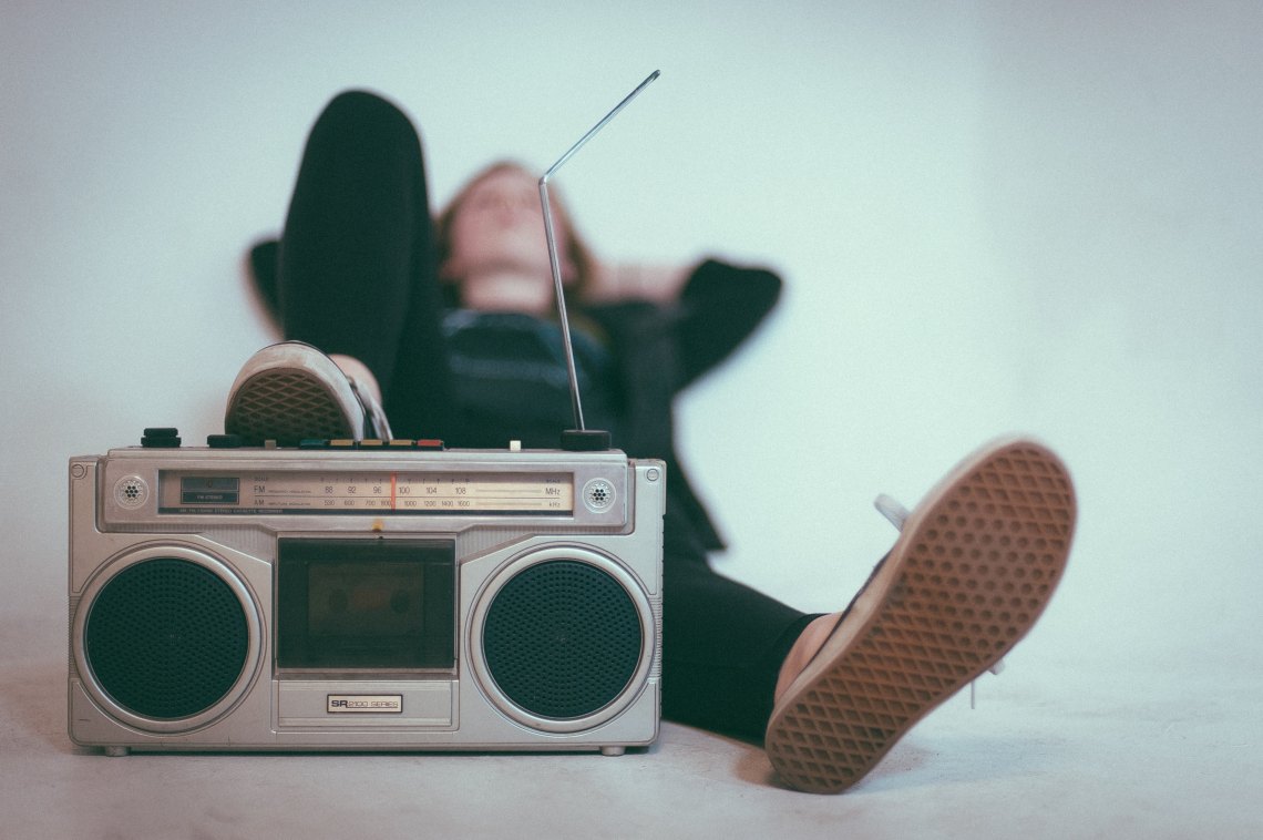 A girl listening to song lyrics