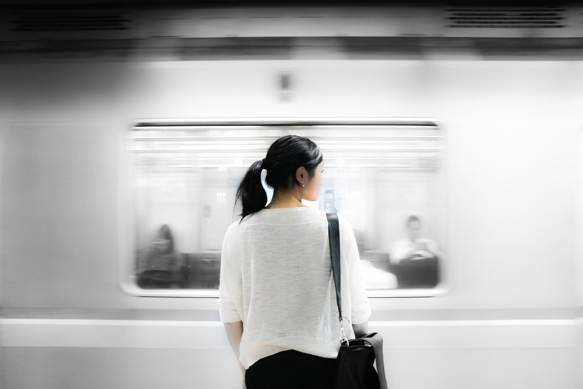 woman standing in front of subway