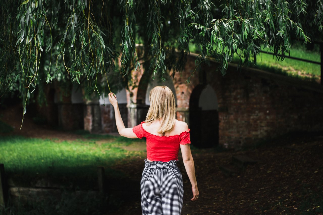 woman standing looking thoughtful