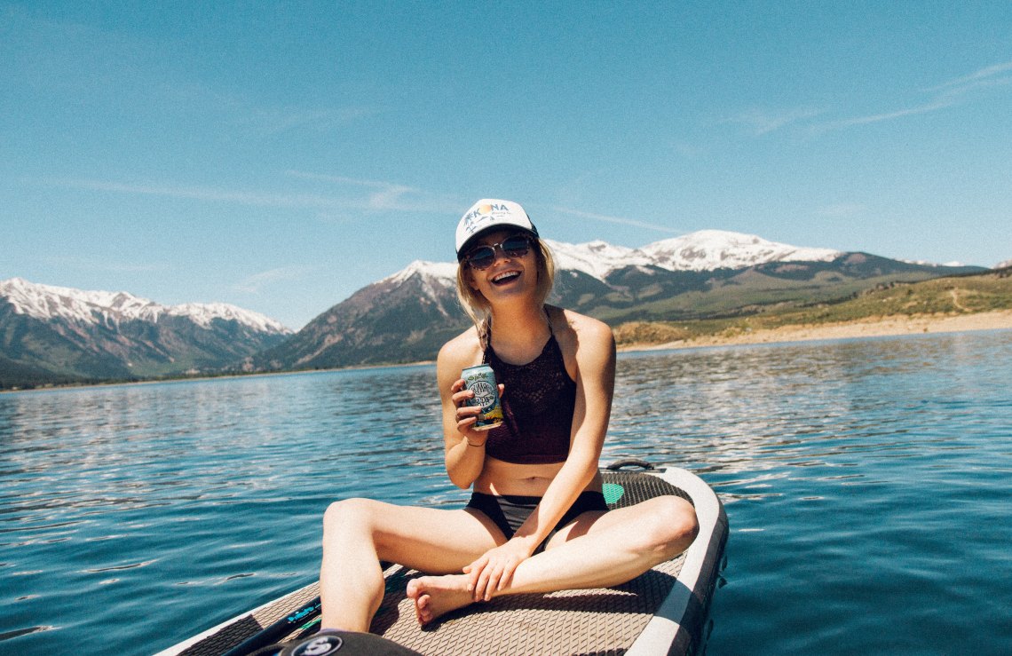 laughing on a paddleboard 