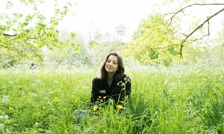 girl in a bunch of grass