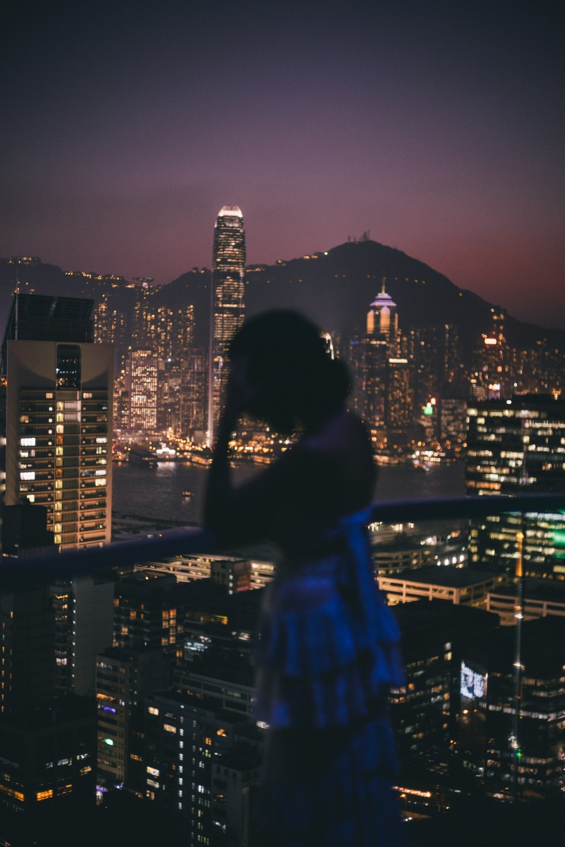 woman standing overlooking city