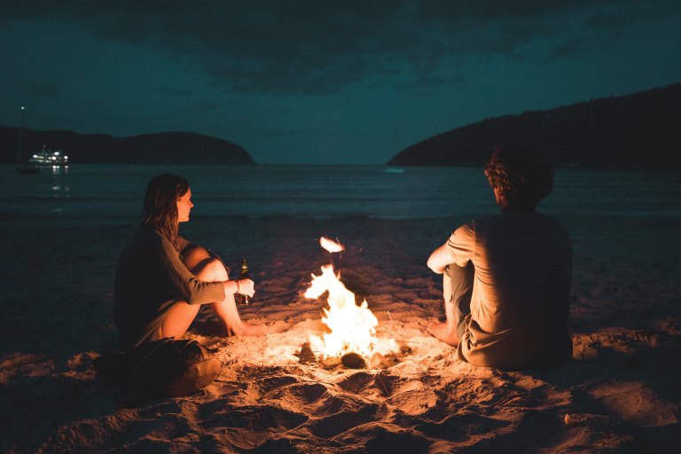 couple at a chill bonfire