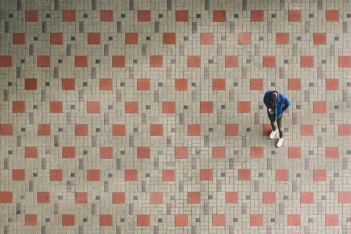 man standing on tiles