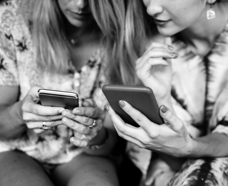 friends checking phones