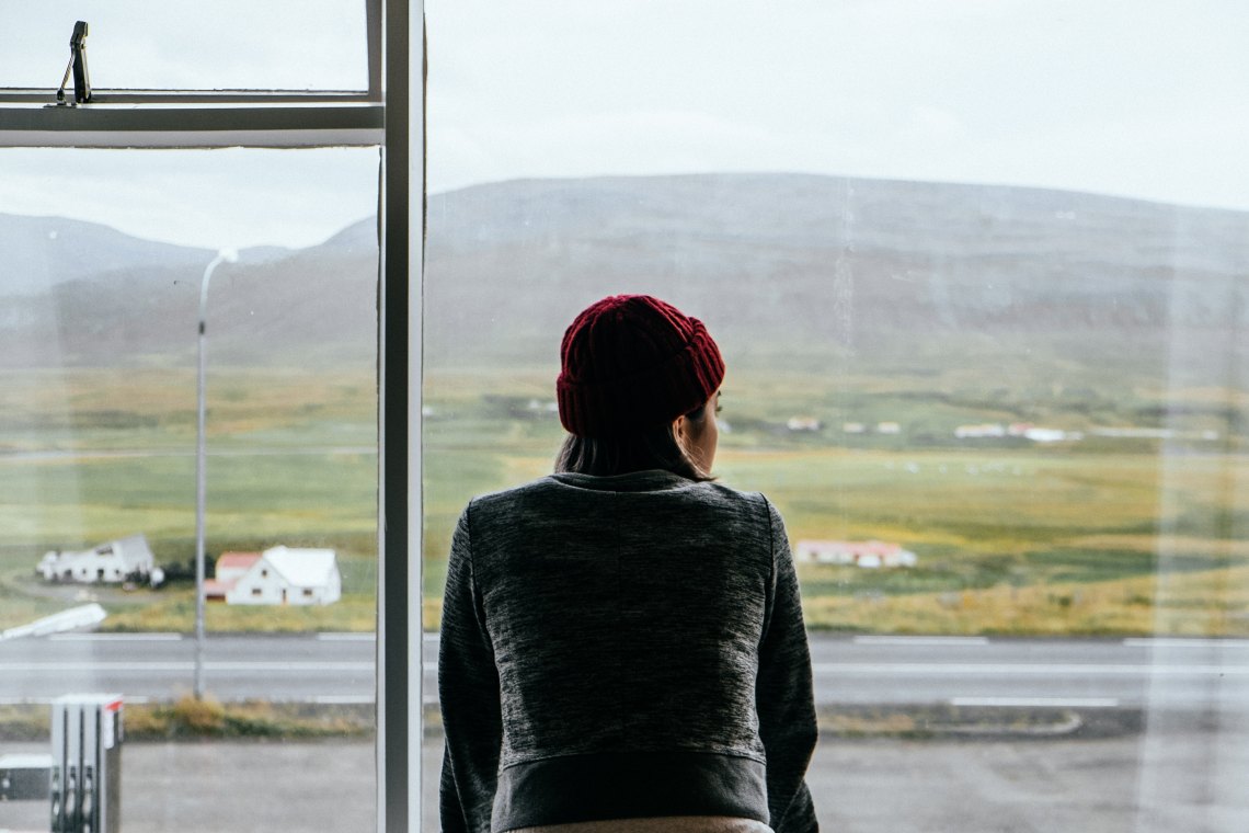 Woman looking out window