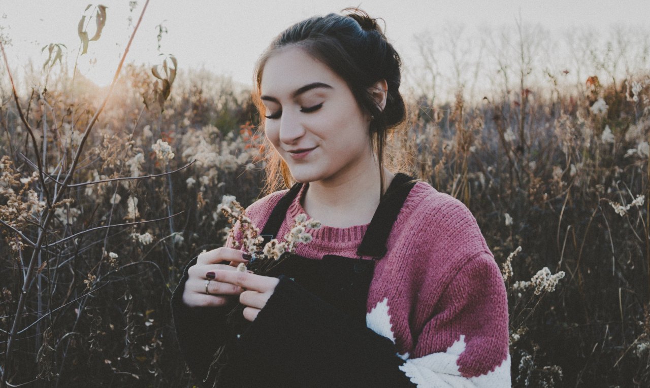 girl with flowers, girl looking down, self-worth, self-love, stop trying to fix yourself