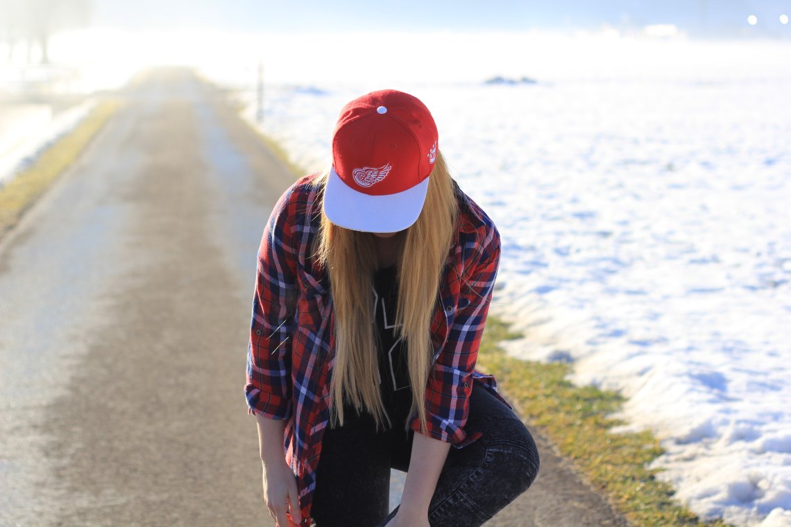 woman wearing hat looking down