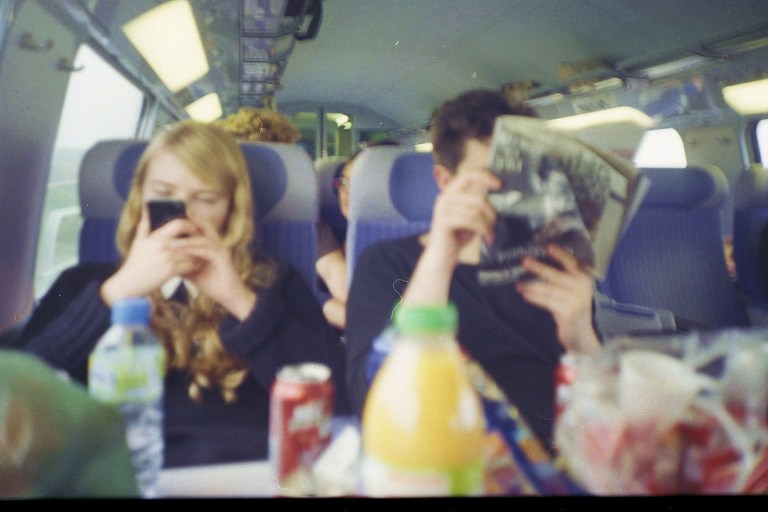 guy and girl on a bus with a lot of snacks