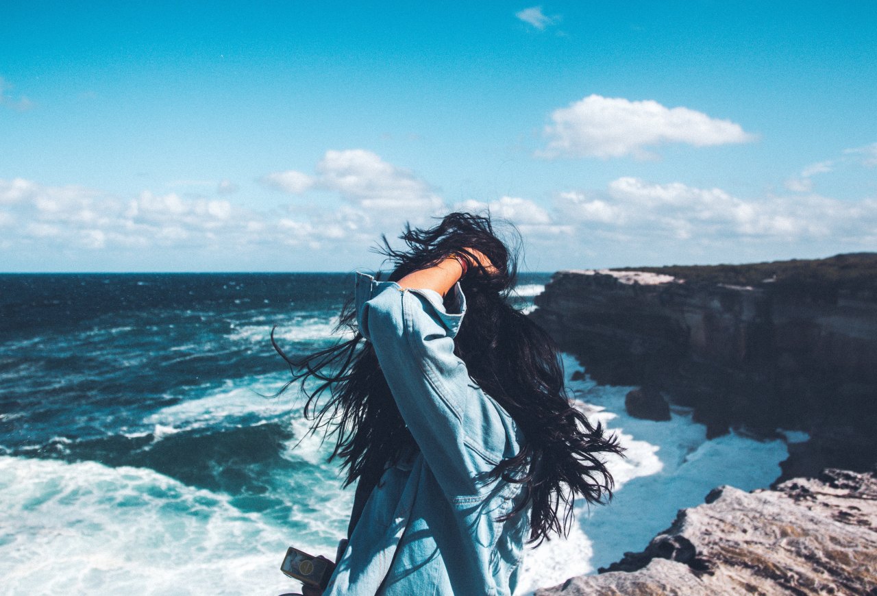 woman standing by beach