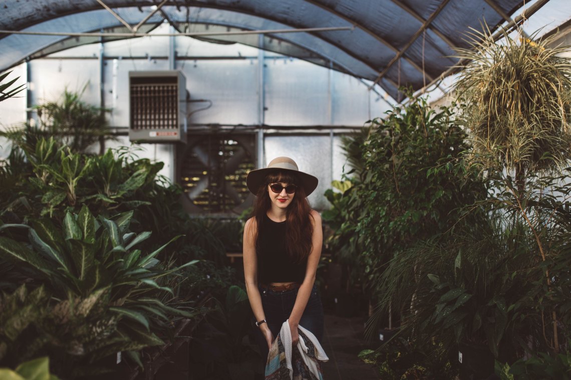 Woman standing in conservatory