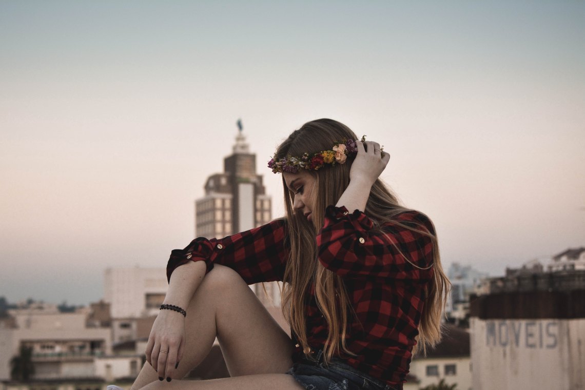 woman sitting with flower crown