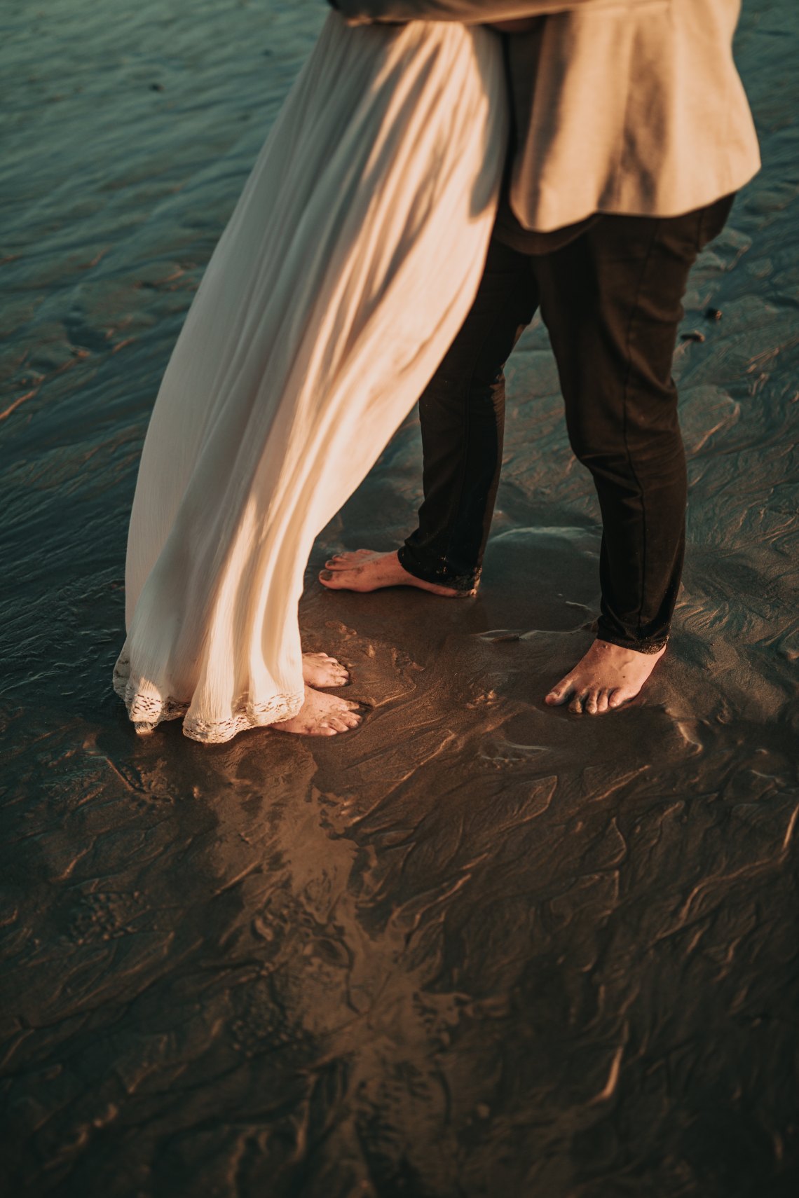 couple standing on beach